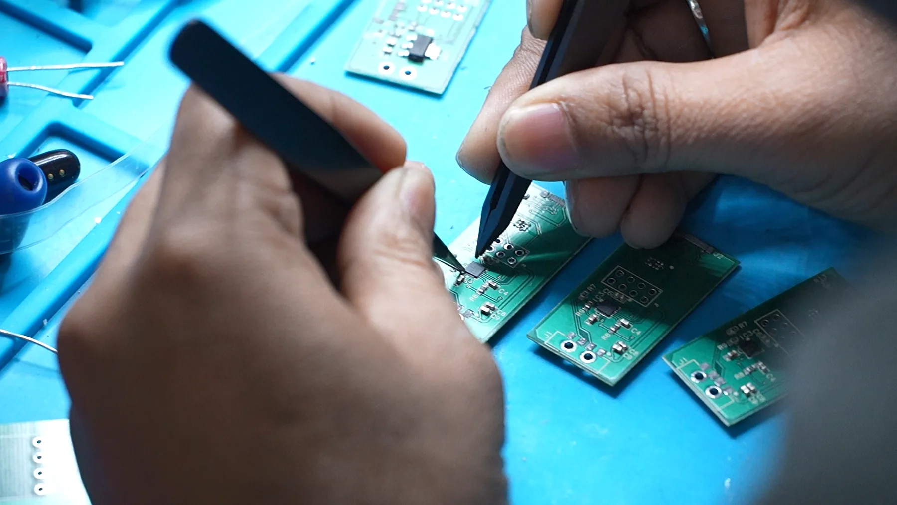 EDTC engineer carrying out precision PCB rework at the Noida electronics lab